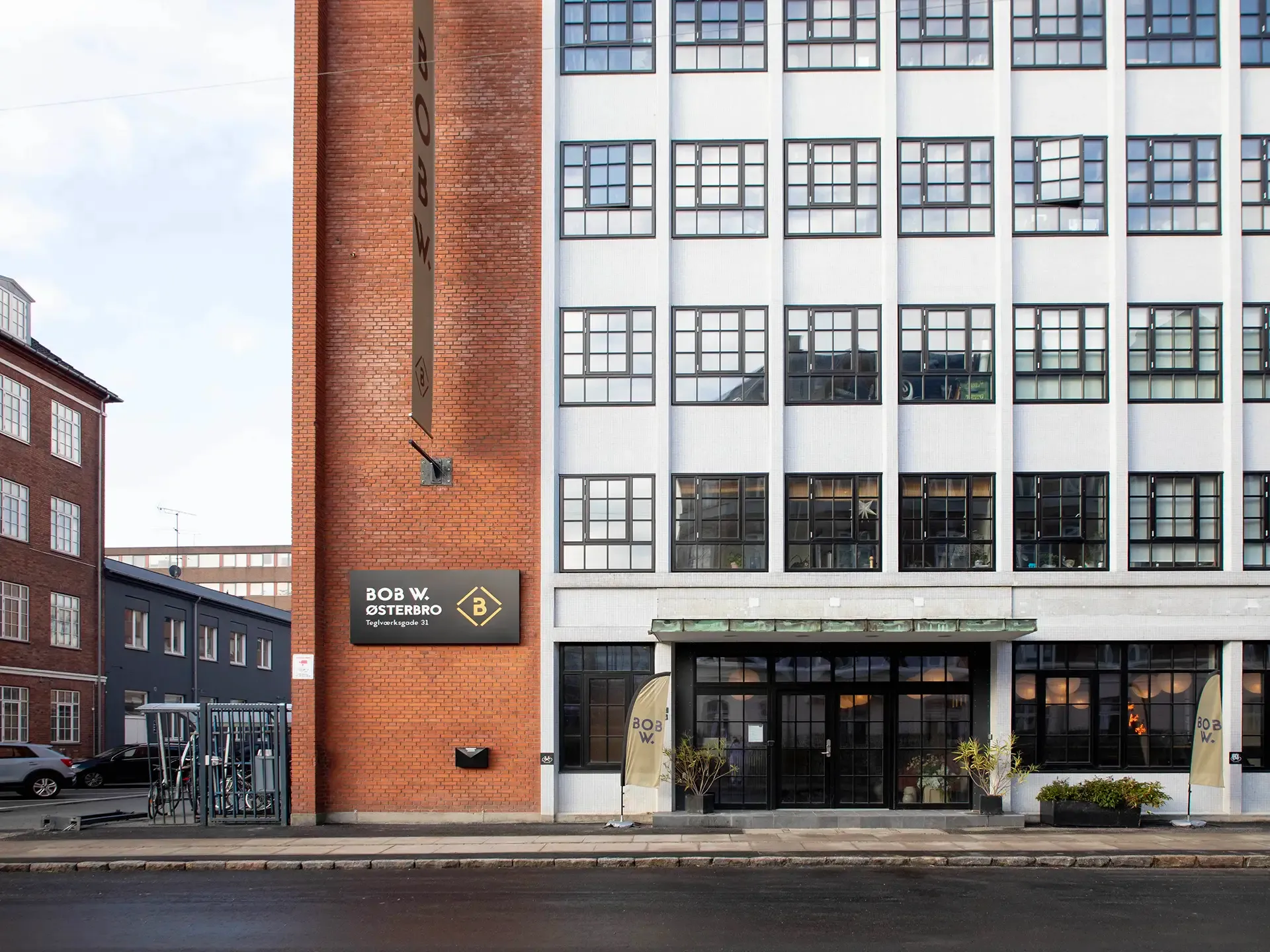 Facade of Bob W Østerbro in Copenhagen, a converted historic factory illustrating adaptive reuse in contemporary hotel design.