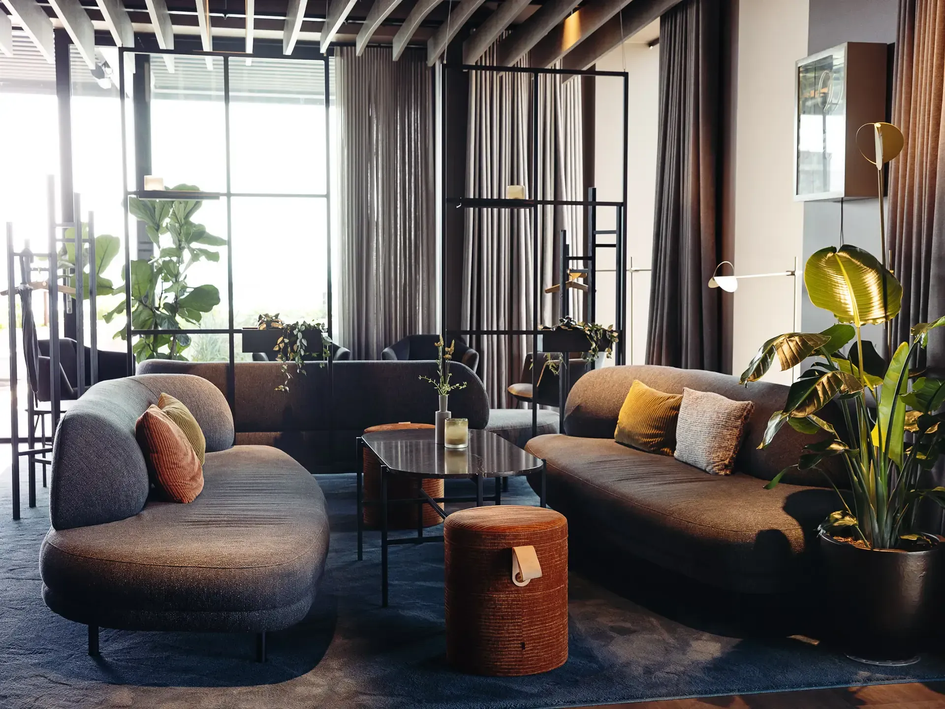 Cocktail bar lounge with bespoke furniture and soft lighting, creating a welcoming social space for restaurant guests.