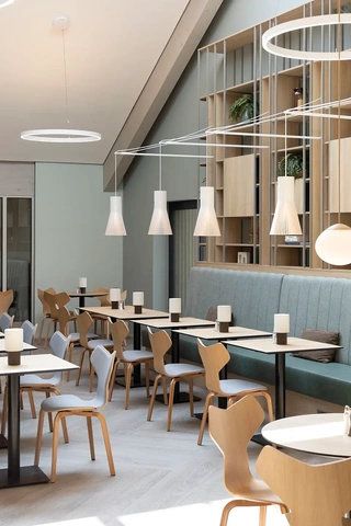 Hotel breakfast restaurant featuring Fritz Hansen Danish design chairs.