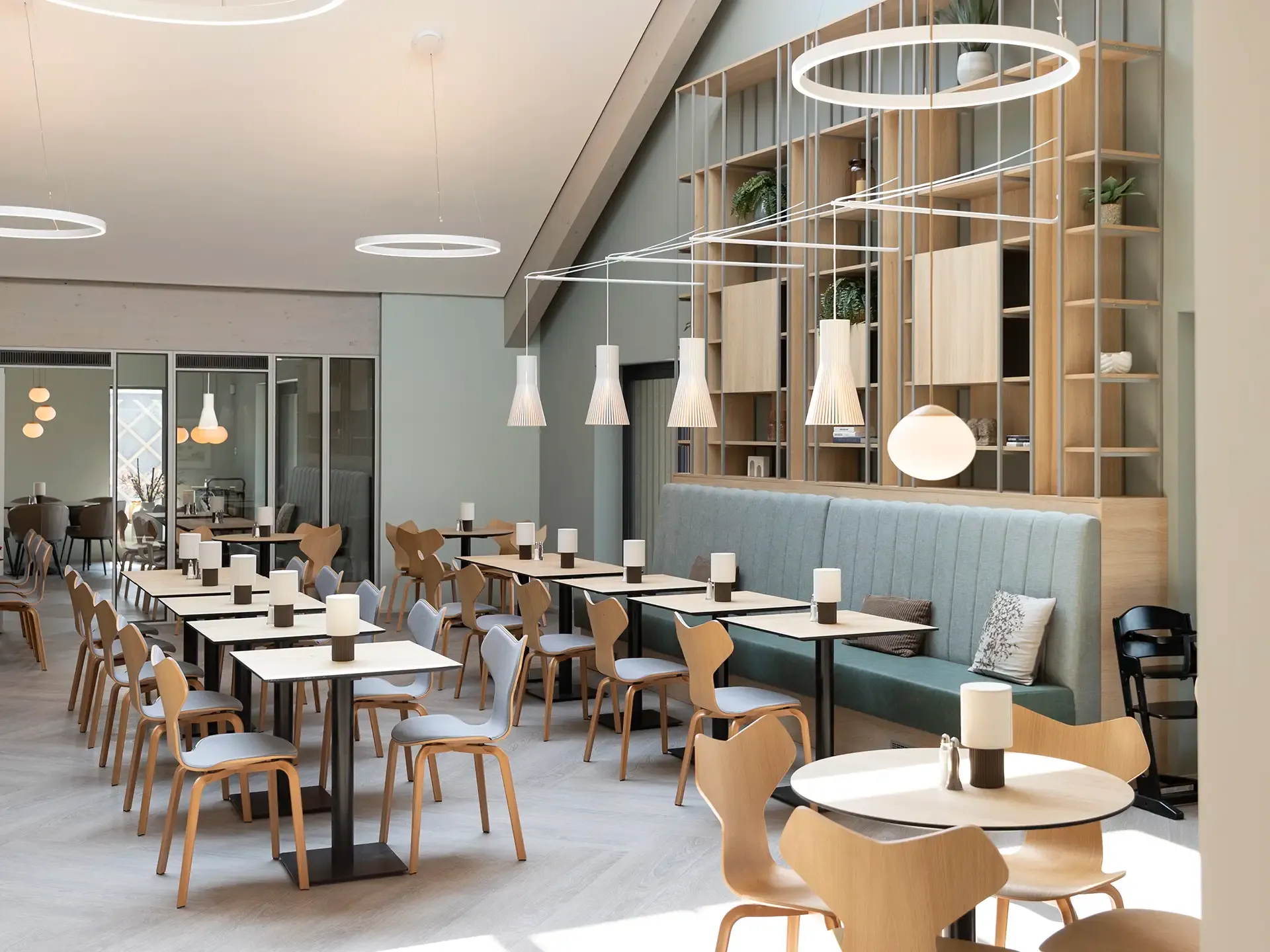 Hotel breakfast restaurant featuring Fritz Hansen Danish design chairs.