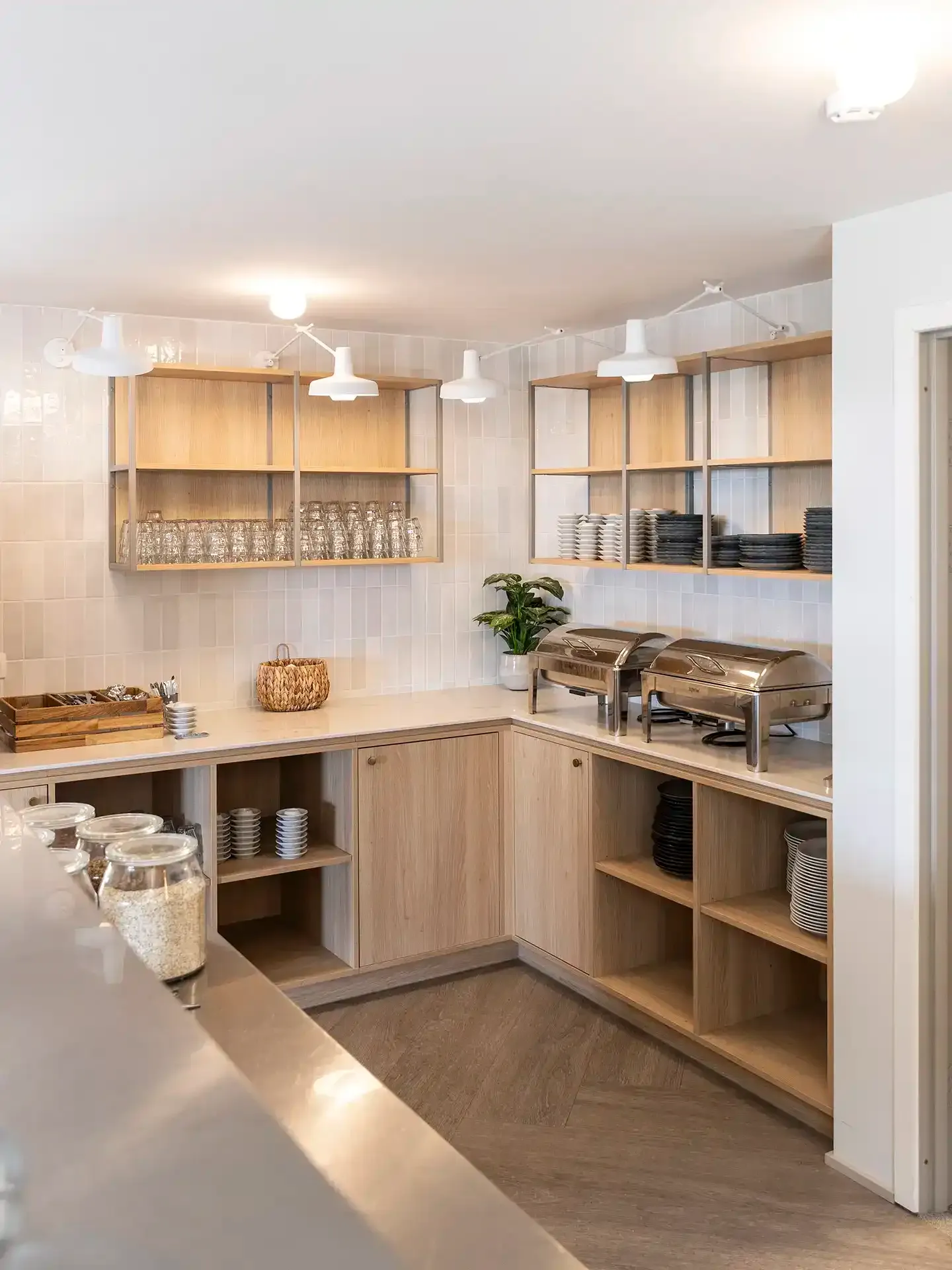 Scandinavian-style hotel breakfast room with buffet.