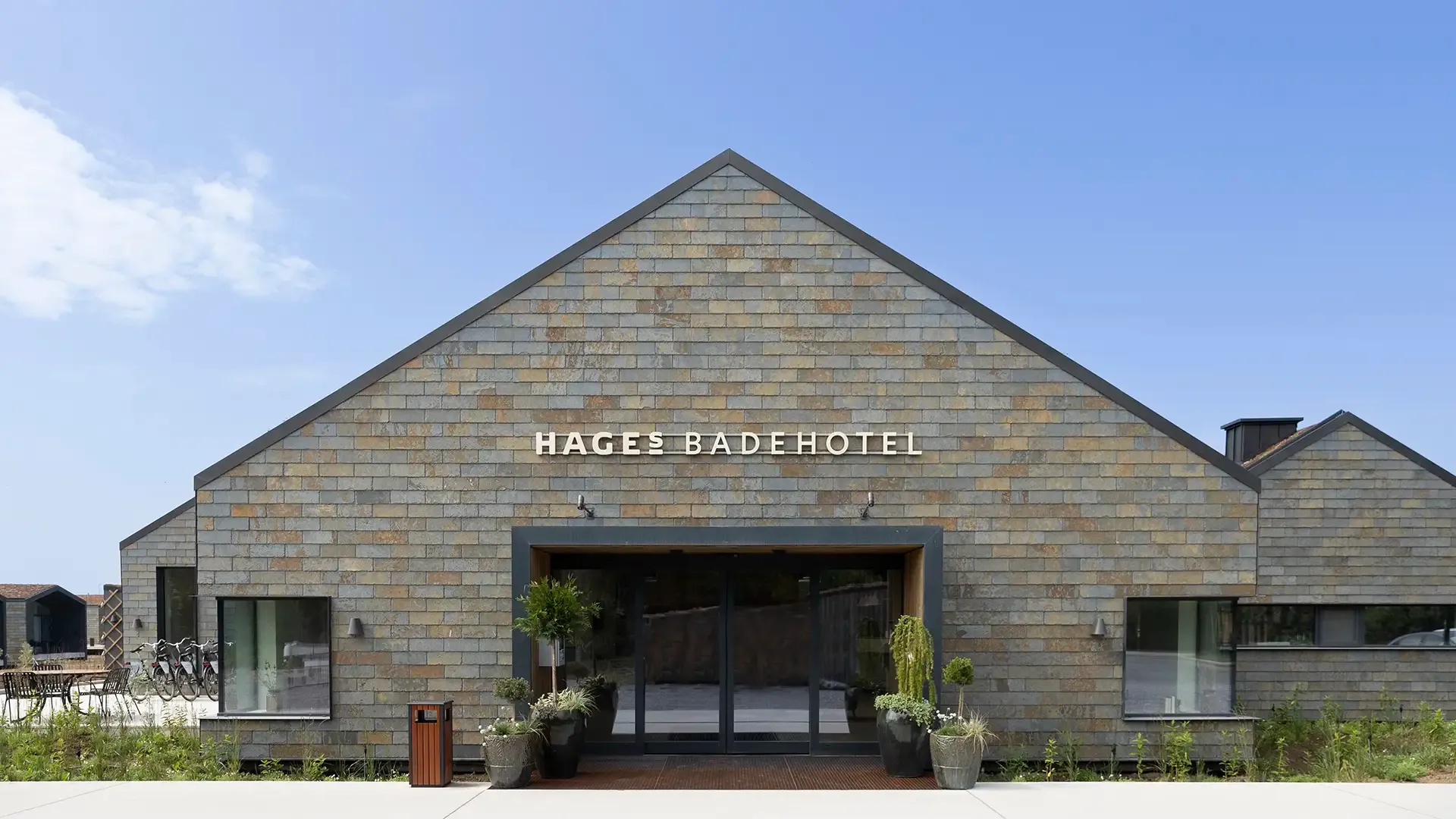 Hotel main building entrance featuring modern architecture at Hages Badehotel Denmark.