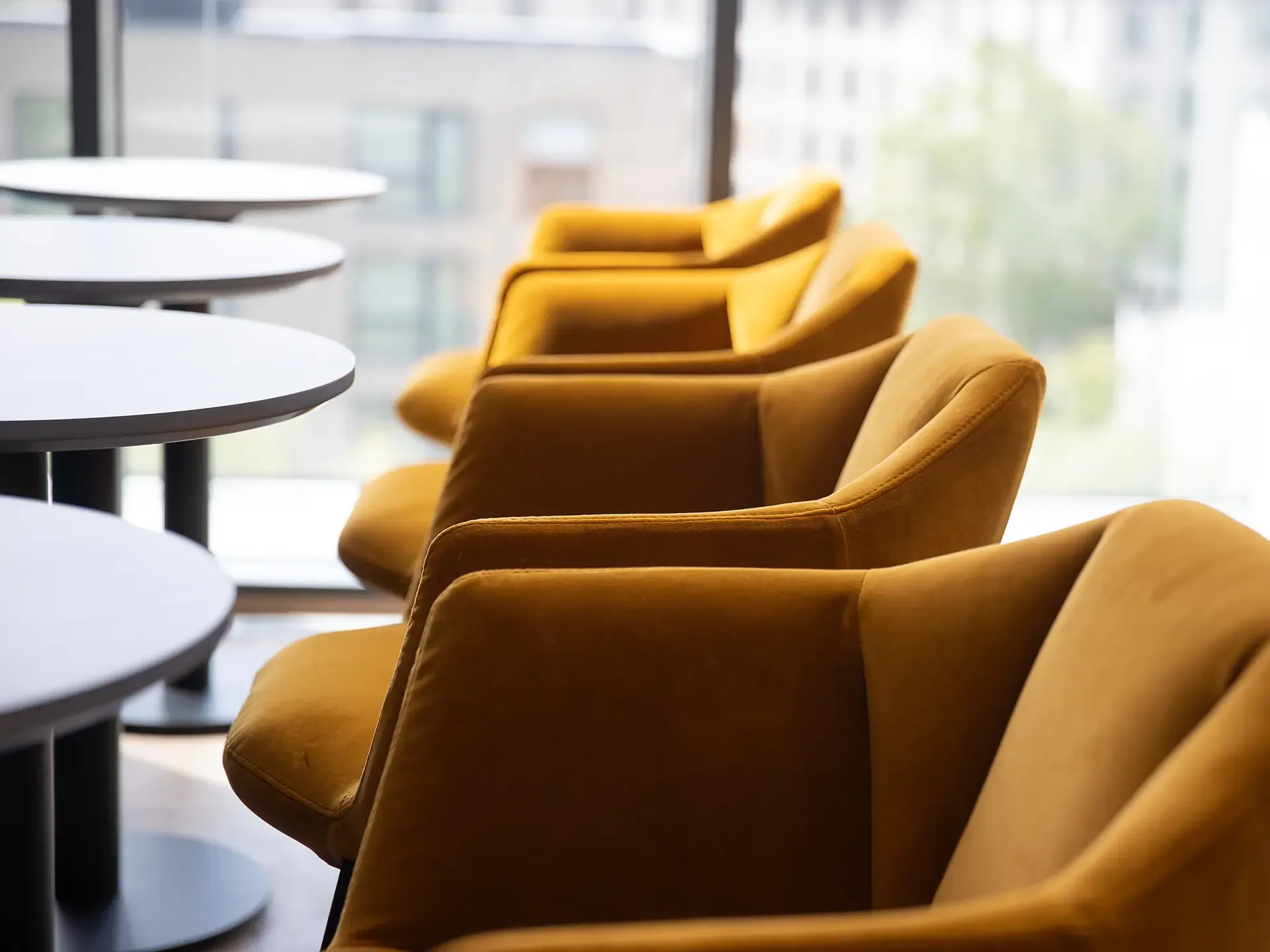 Hotel seating with yellow chairs close-up view.