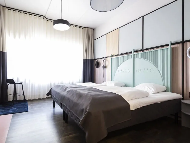 Modern Hotel room design with double bed and head board