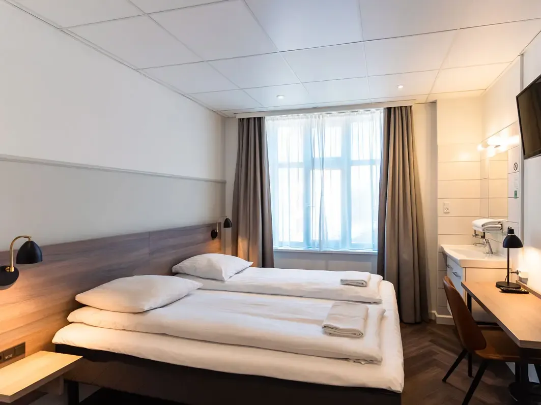 Go Hotel Saga Hotel room with contemporary furniture and Nordic-inspired design by Third.space.