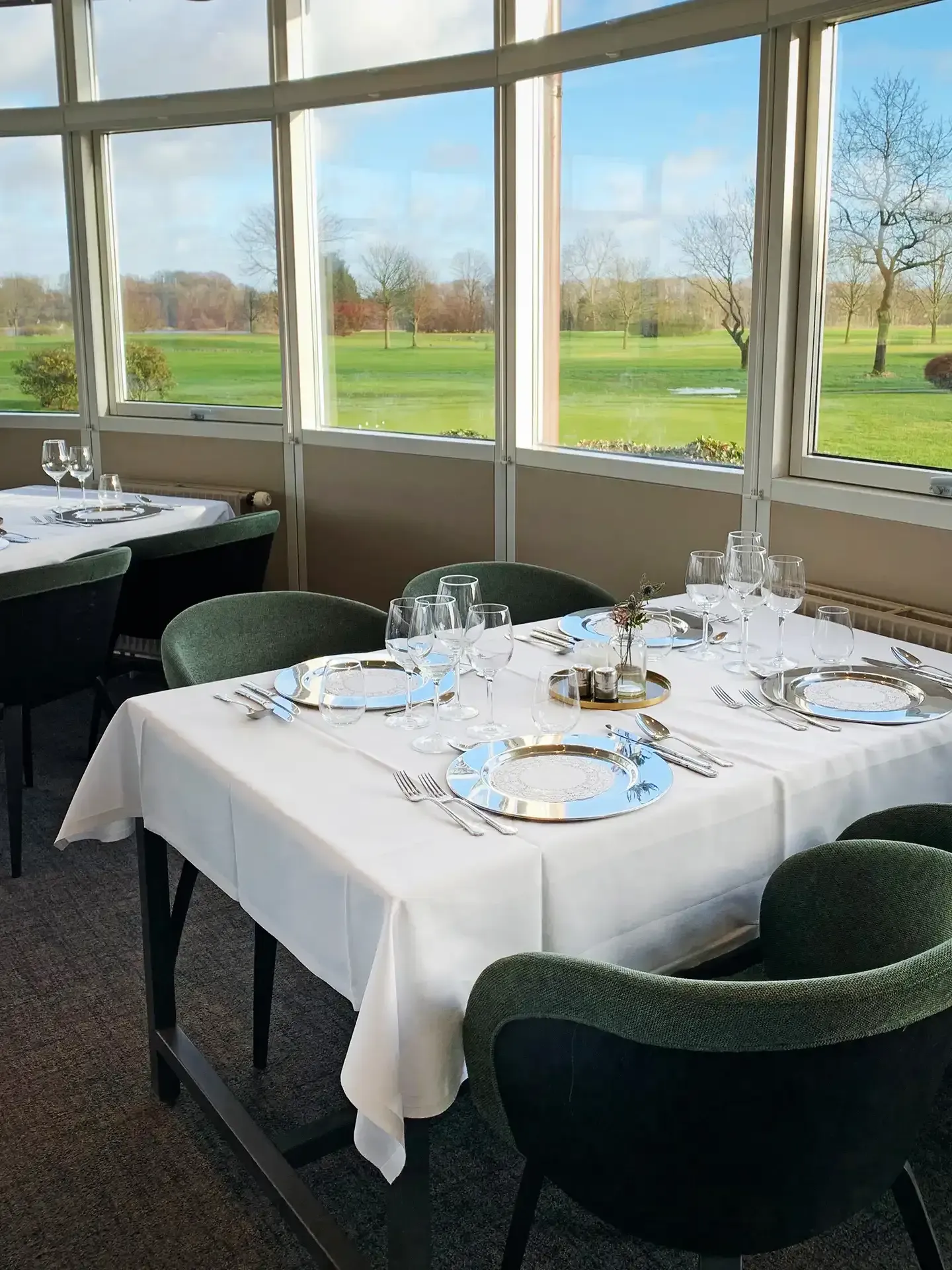 Golf course restaurant with ambient lighting and table settings