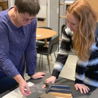 Interior designer Lisbeth Schonert and design manager Maja Kjærgaard from Third.space reviewing material samples for hotel and resort design projects.
