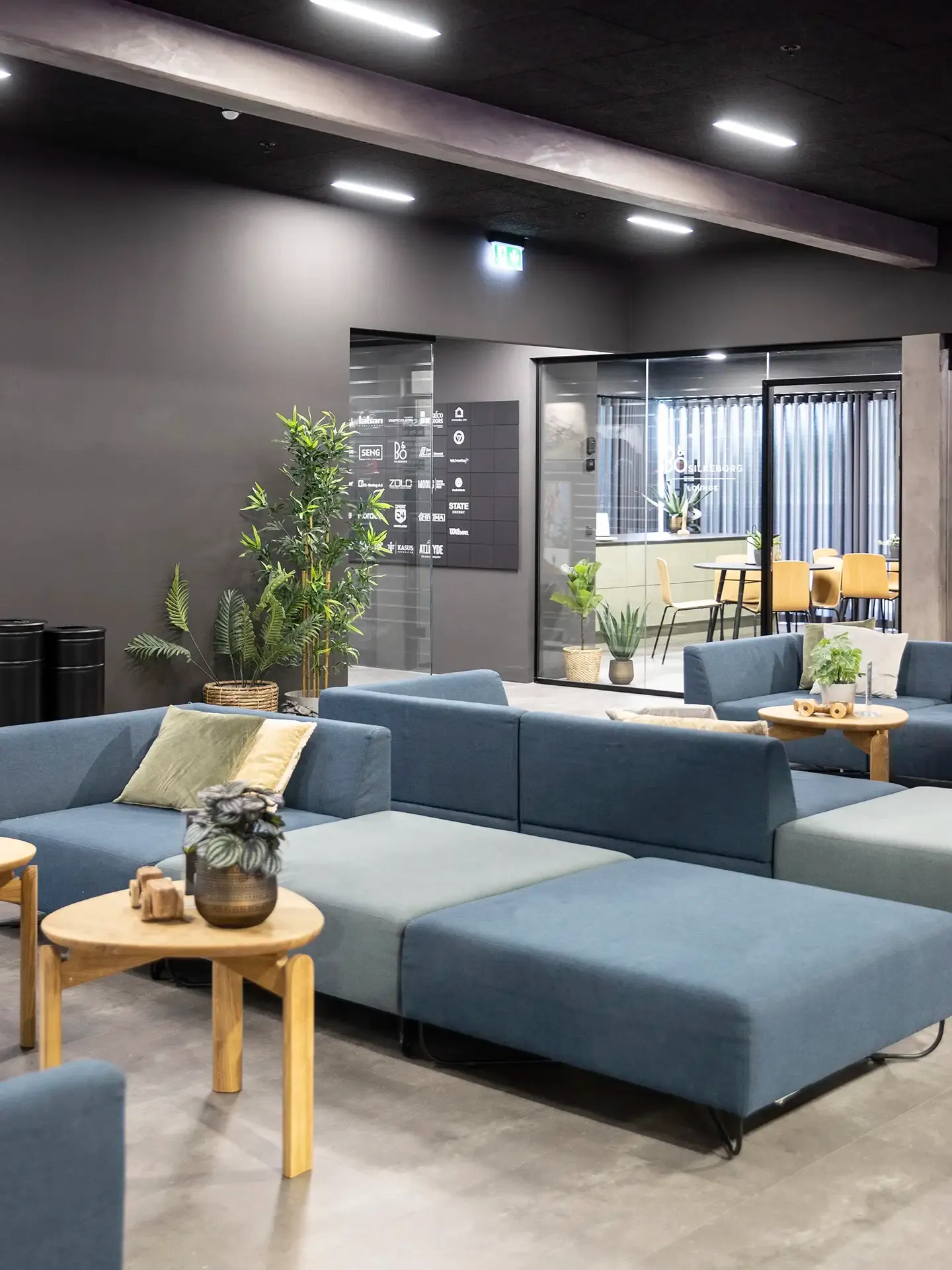 Stylish lounge at Match Padel Center soft seating designed by Third.space. 