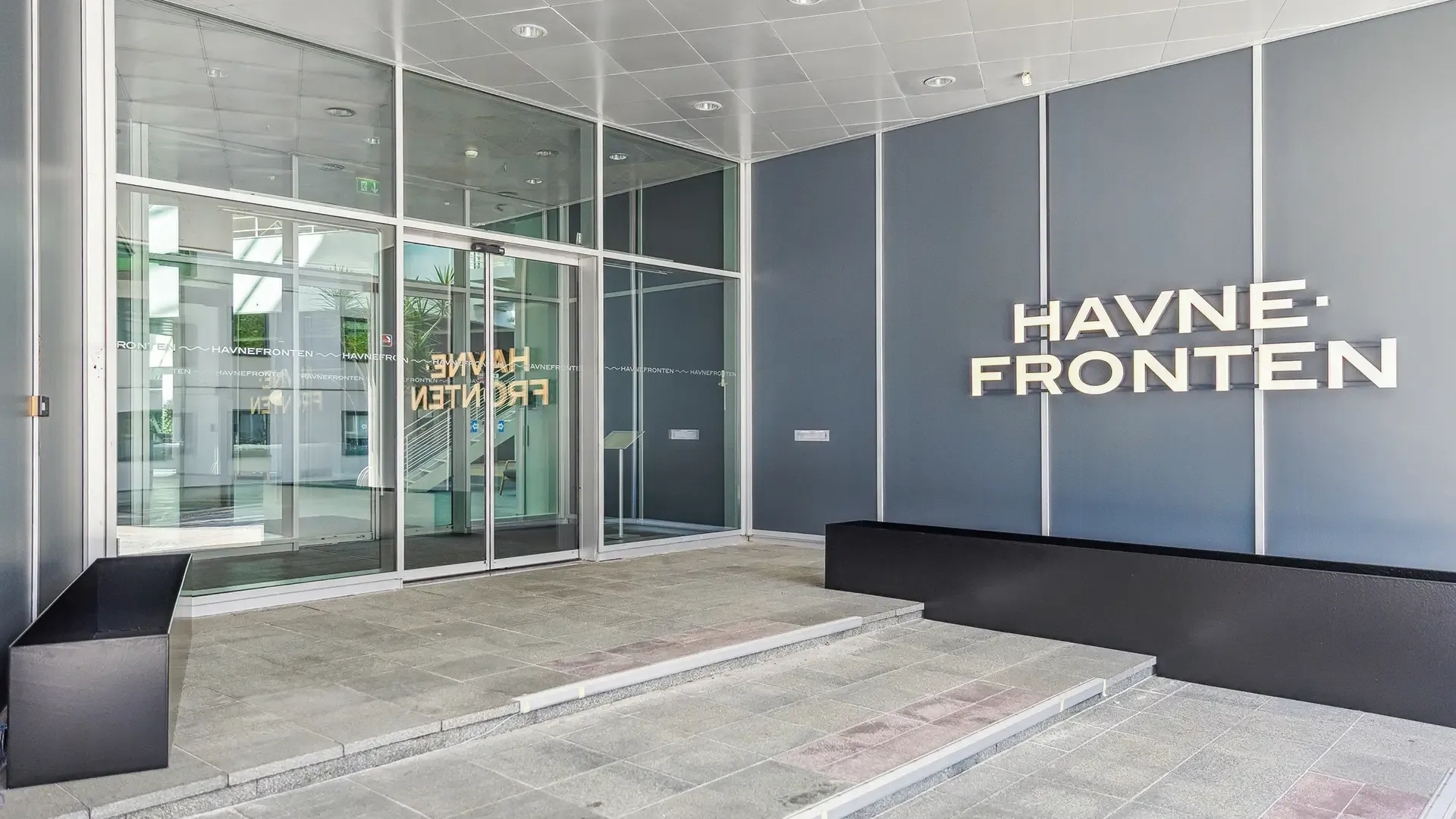 Facade signage with LED letters for modern office buildings, emphasizing branding and company visibility.
