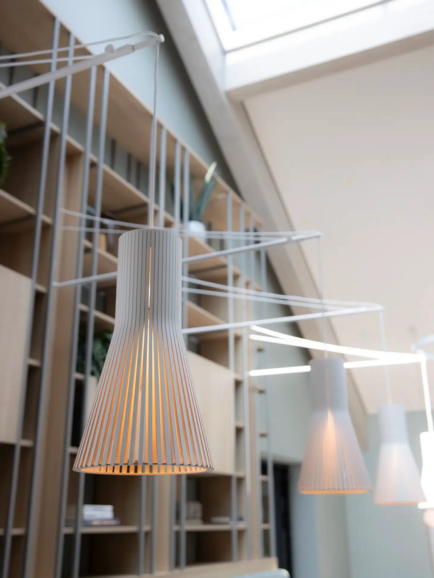 Pendant lighting fixtures in scnadinavian hotel breakfast restaurant.