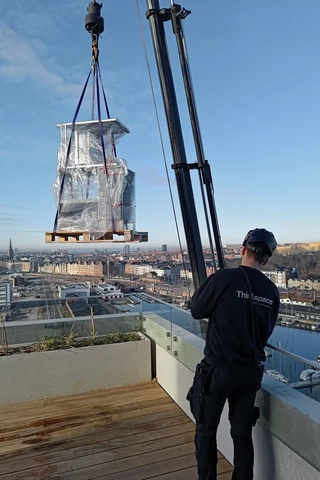 Special furniture is hoisted up by an employee from Third.space.