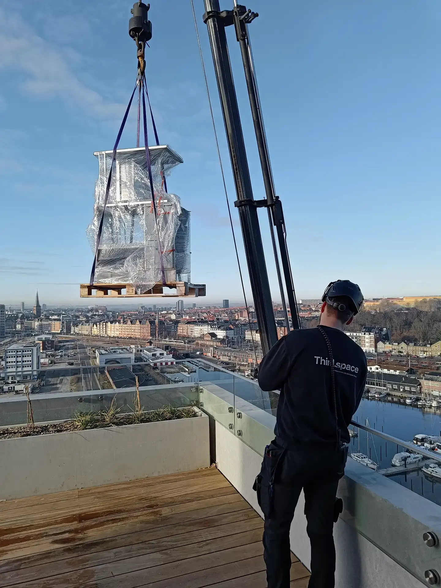 Special furniture is hoisted up by an employee from Third.space.