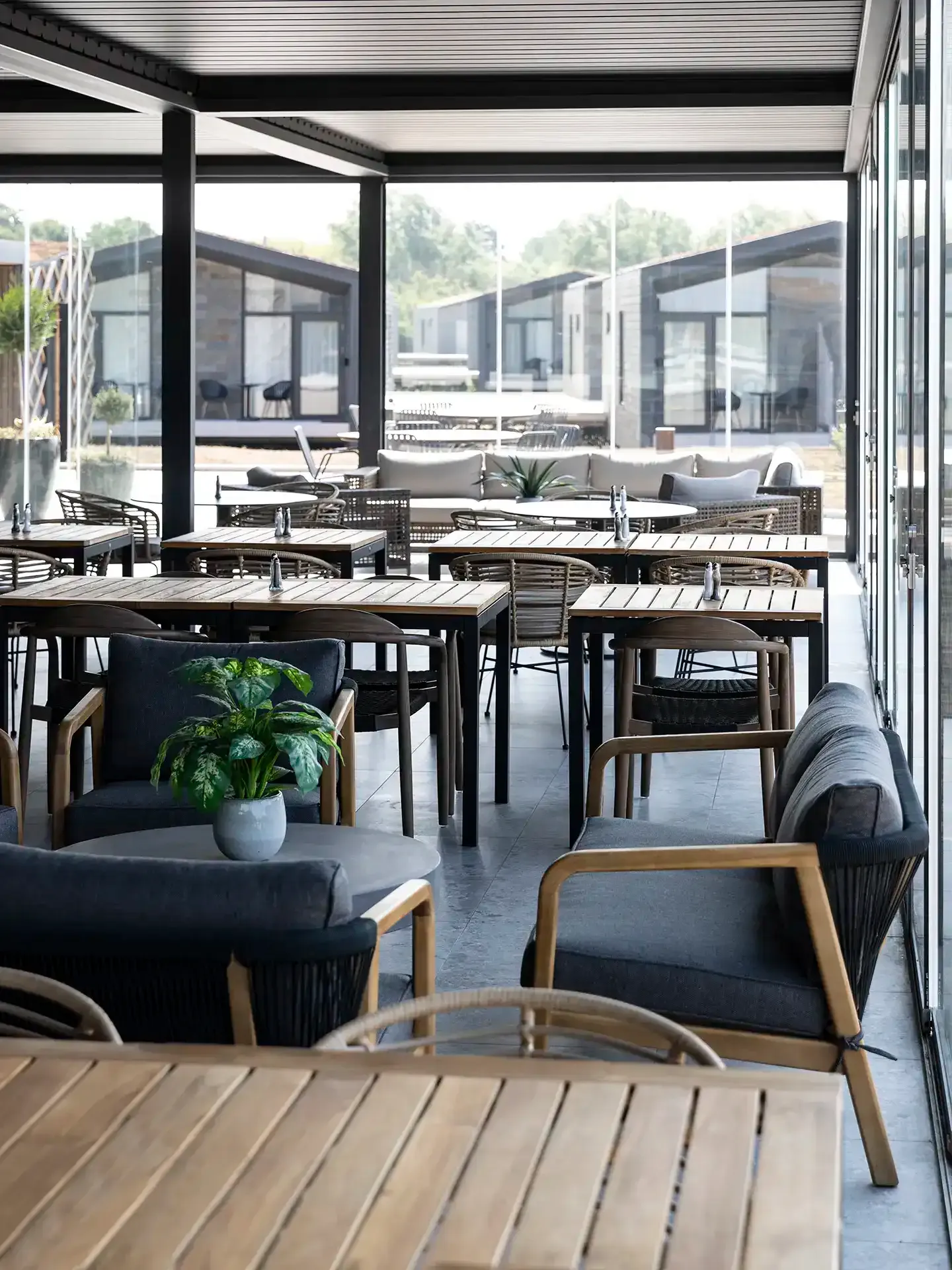 Outdoor restaurant terrace seating with durable hotel furniture.