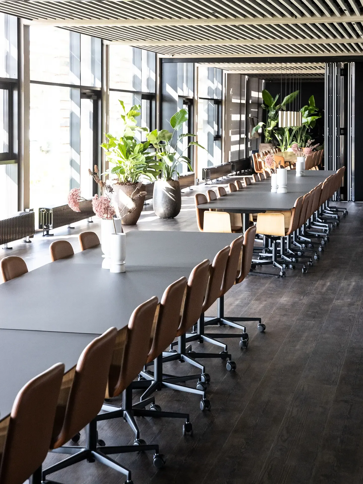 Large conference room at Selected Car Group with long table, modern chairs, and integrated AV solutions.