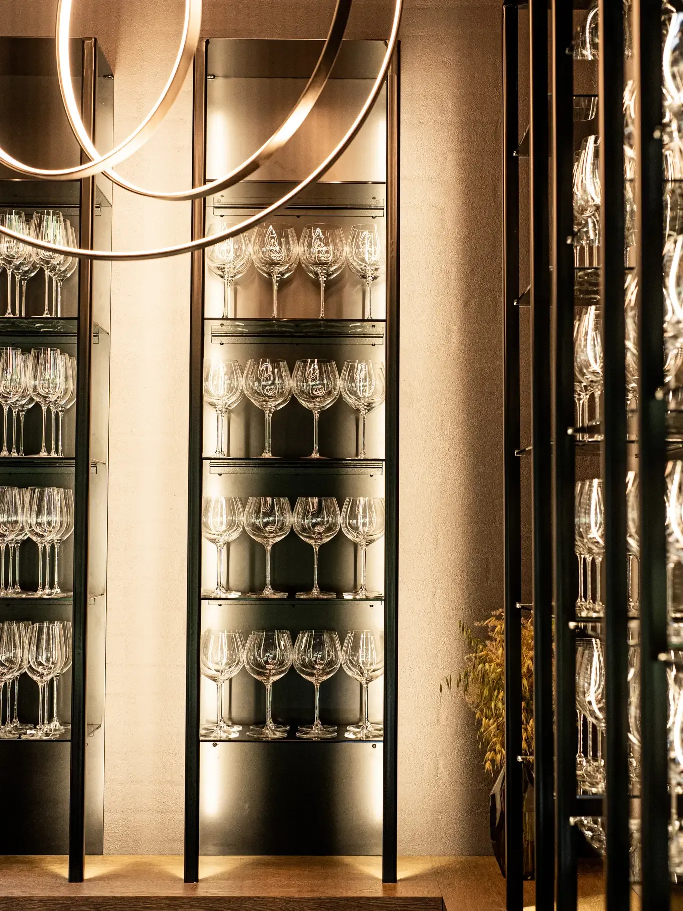 Wine glass storage with exclusive lighting in fine dining restaurant HimmerRiget.