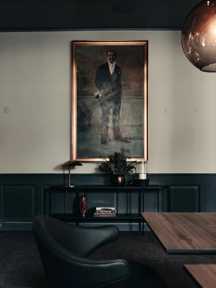 Bespoke restaurant design with classic portrait artwork and sophisticated styling at Richards Bar, Hotel Royal.