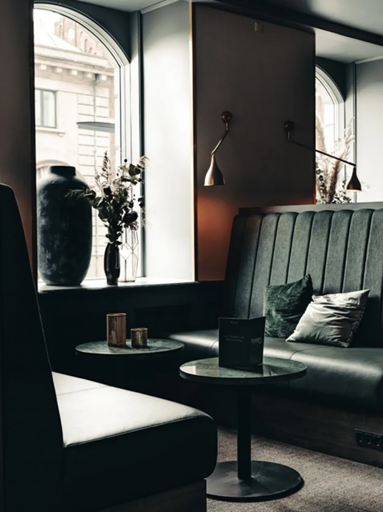 Luxury restaurant stalls with high-back upholstered seating designed for privacy and comfort at Richards Bar.