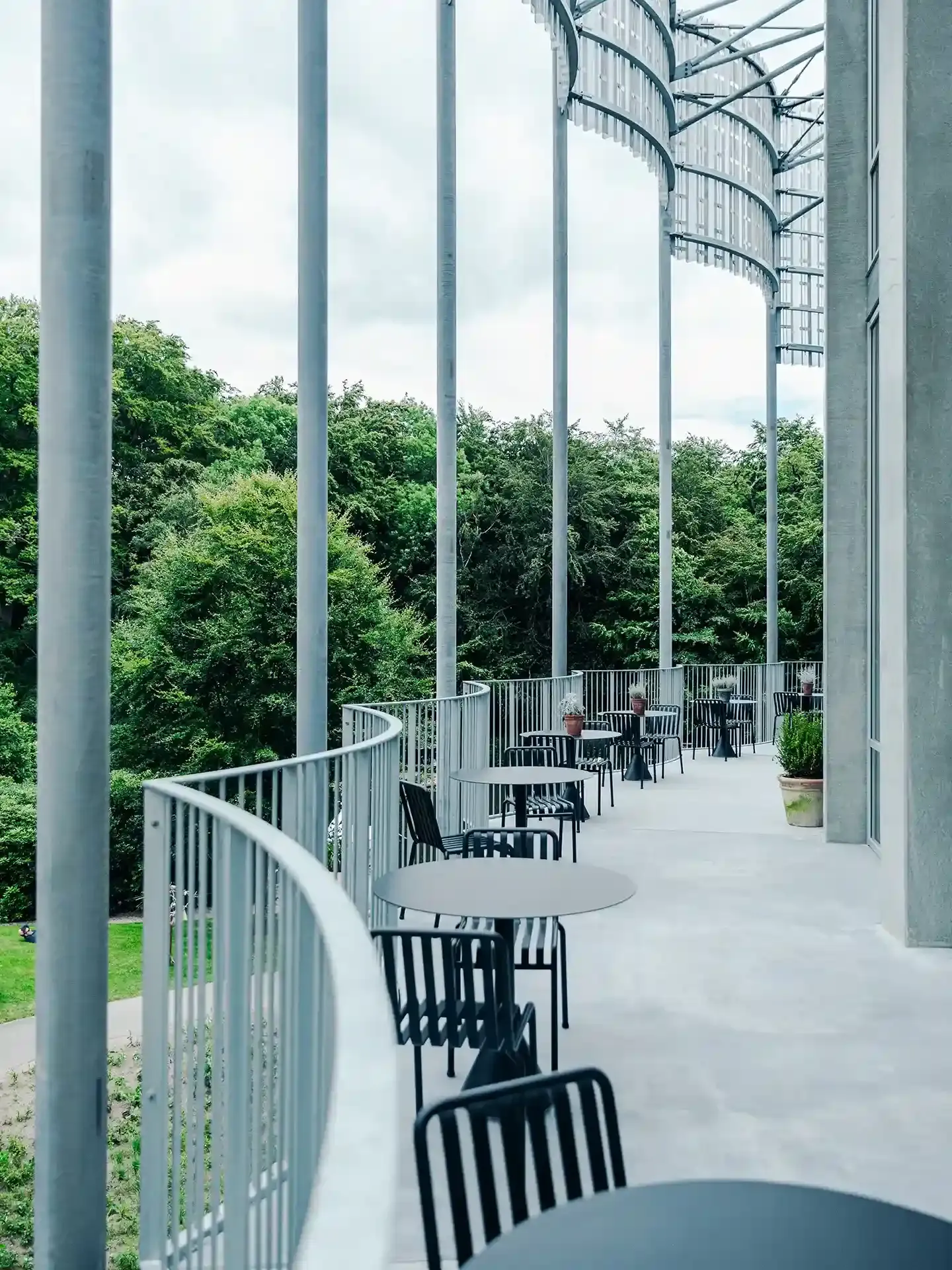 Scandinavian outdoor dining area with Danish-designed furniture, combining weather-resistant materials and timeless elegance.