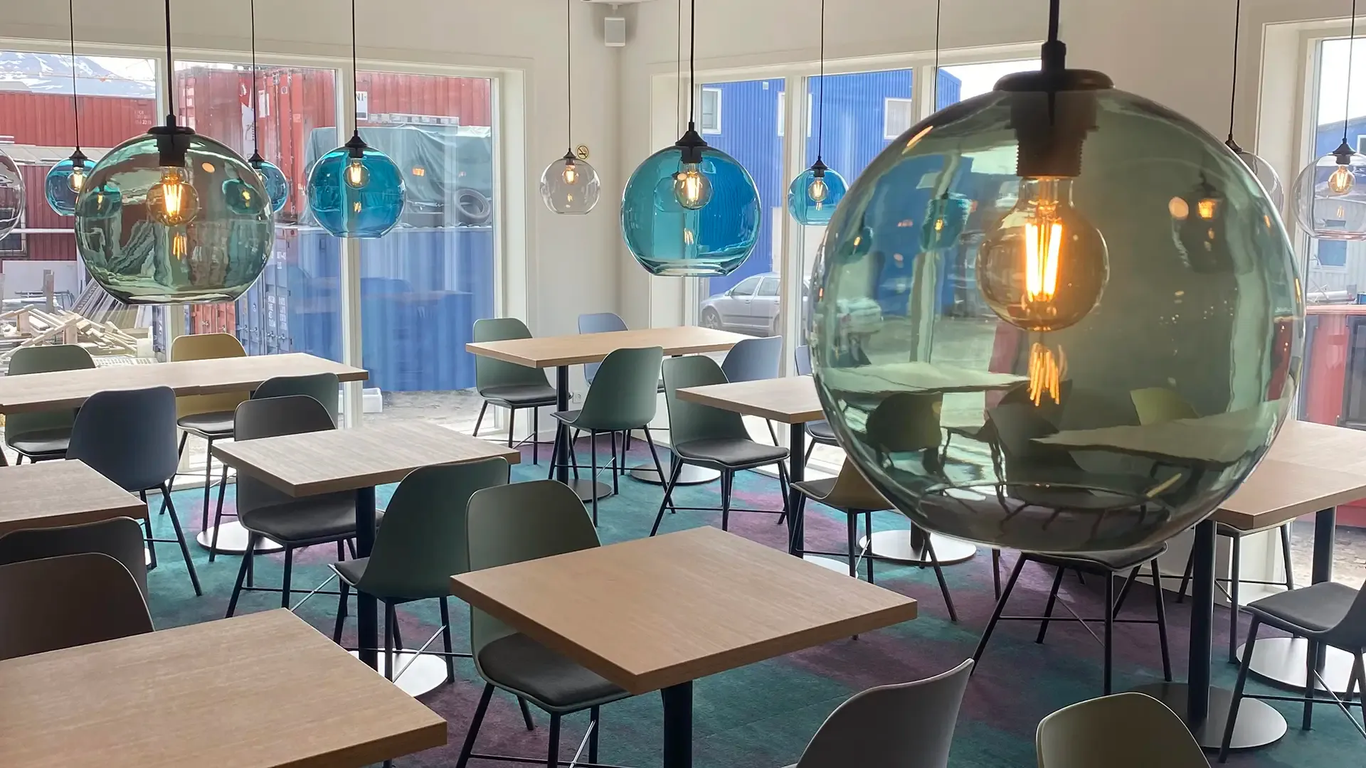 Flexible hotel breakfast restaurant interior design with chairs and dining tables. Inspired by the nothern light.