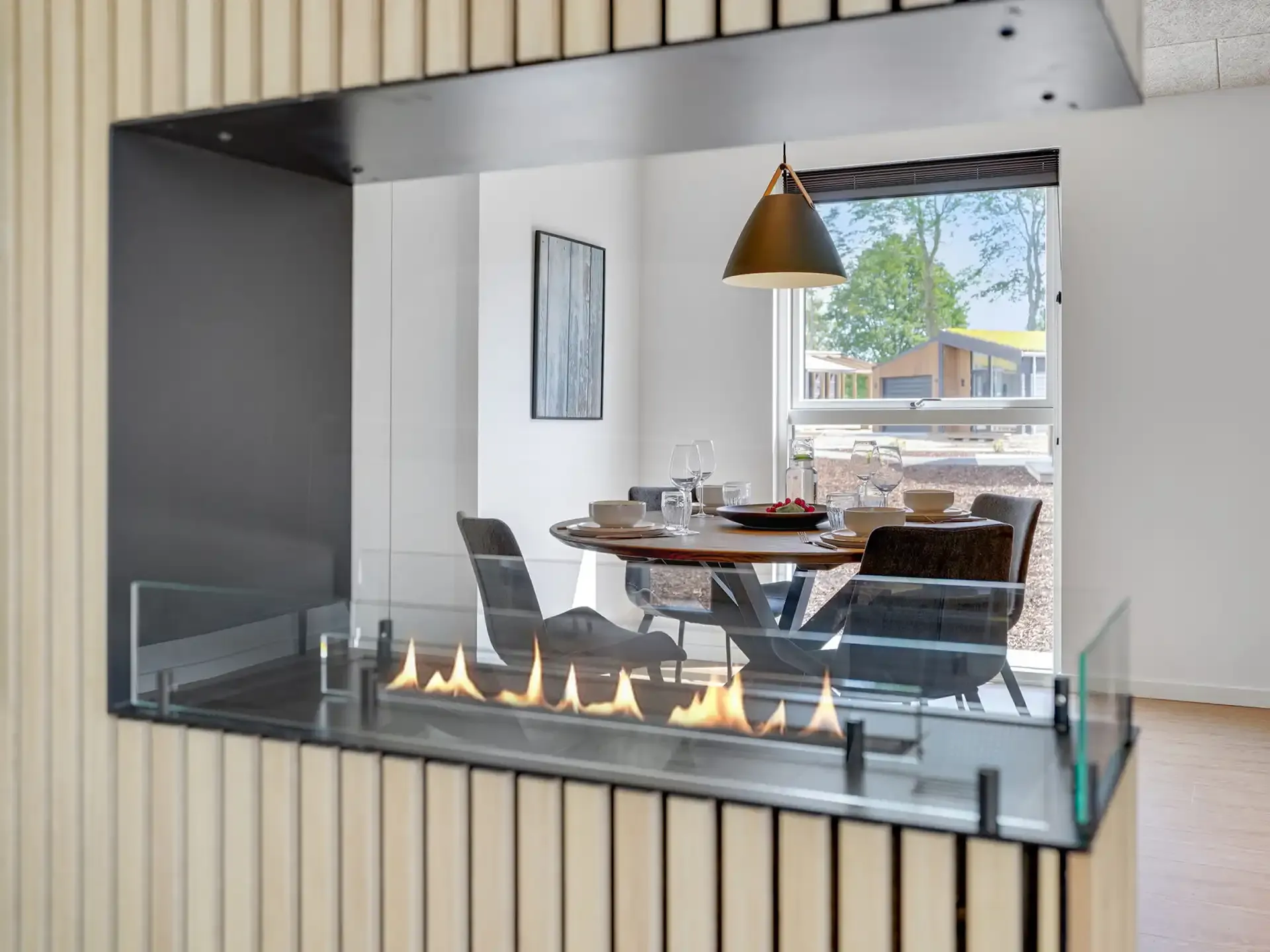Fireplace and dining area in golf lodge interior