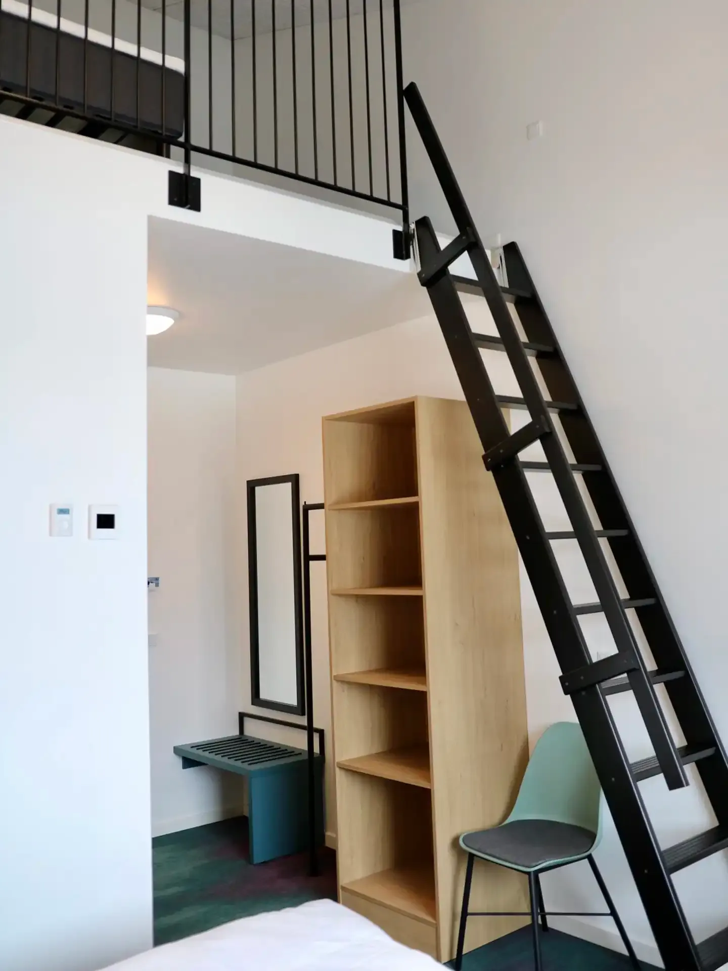 Hotel room fitted with oak storage unit and custom furniture designed by Third.space