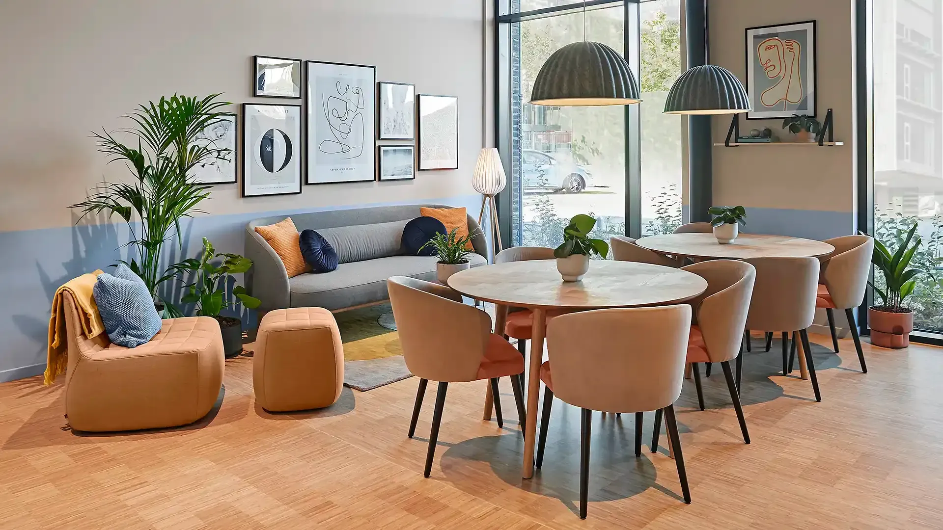 Student living interior design. Modern lounge in orange tones with sofa and dining set.