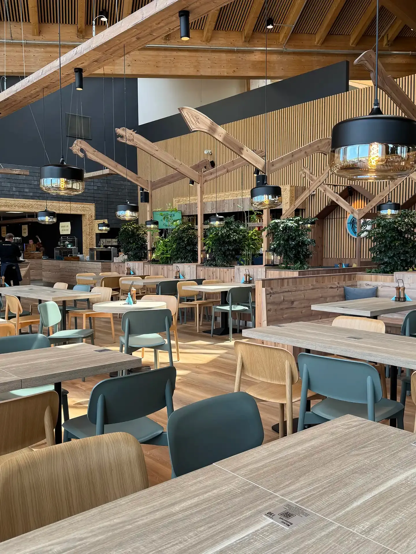 Scandinavian-inspired restaurant interior design at Nordborg Resort with modern furniture supplied for high-traffic use.
