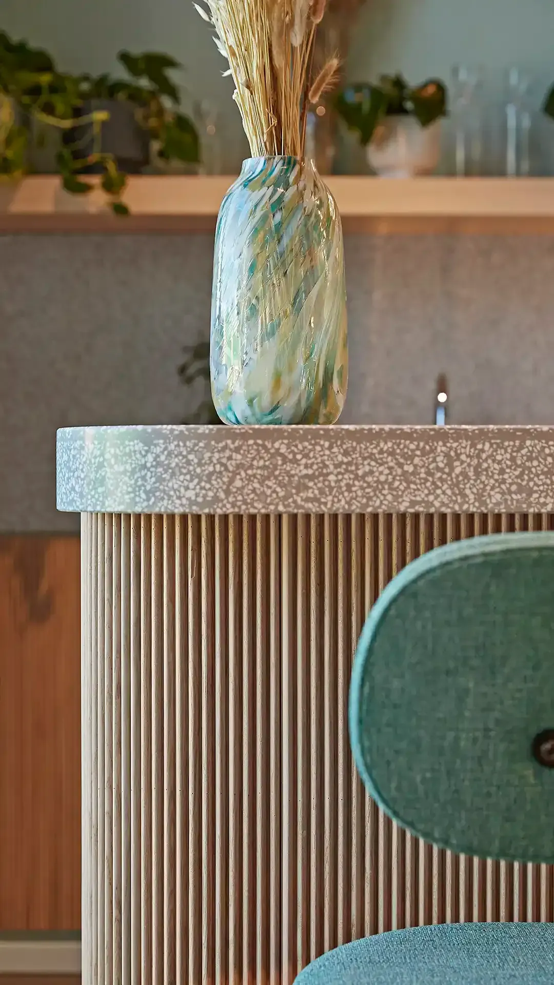 Student living coffee bar interior detail wood fabric and stone